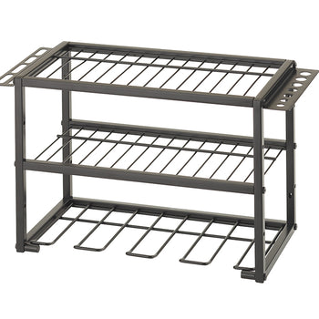A three-tier, dark gray metal rack for organizing power tools and accessories. The top two tiers are wire shelves, and the bottom tier has several U-shaped holders for hanging cordless drills.
