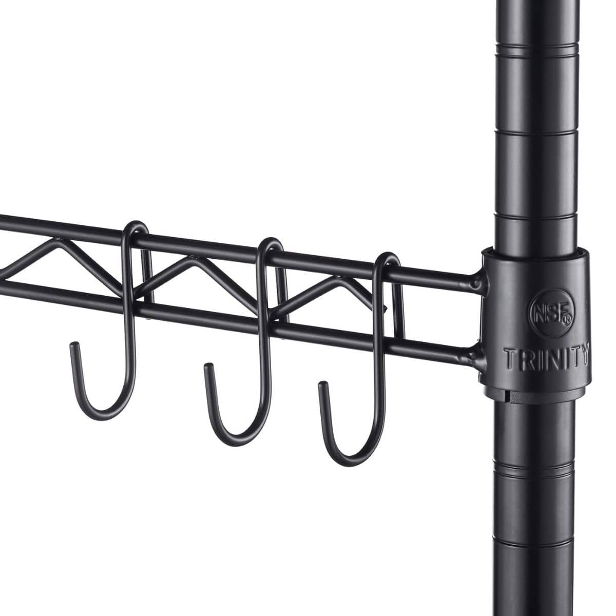 A close-up shows a section of black wire shelving with a sidebar featuring three hanging hooks. The "TRINITY" brand name and an NSF certification mark are visible on the shelving unit's pole.