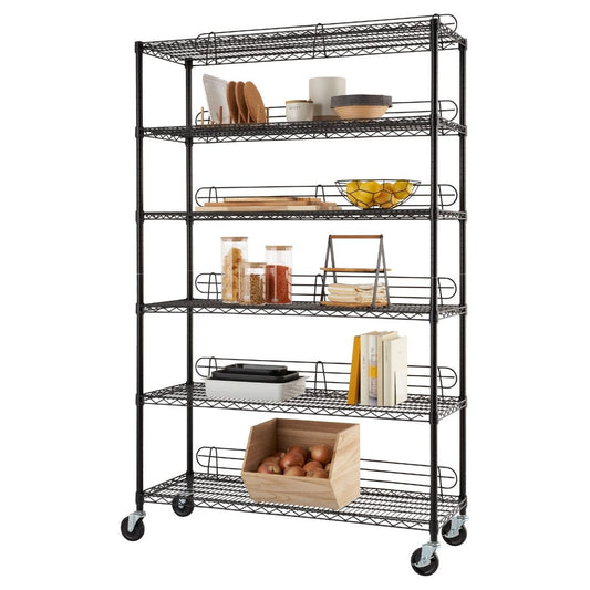 A tall, black wire shelving unit with six tiers stands on wheels. Various household items, including dishes, food containers, books, and a wooden bin of fruit, are organized on the shelves.
