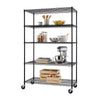 A black, five-tier wire shelving unit on wheels is shown against a white background. The shelves hold various kitchen items, including wooden utensils, bowls of fruit, jars, mixing bowls, baking sheets, a stand mixer, and wooden crates with vegetables.
