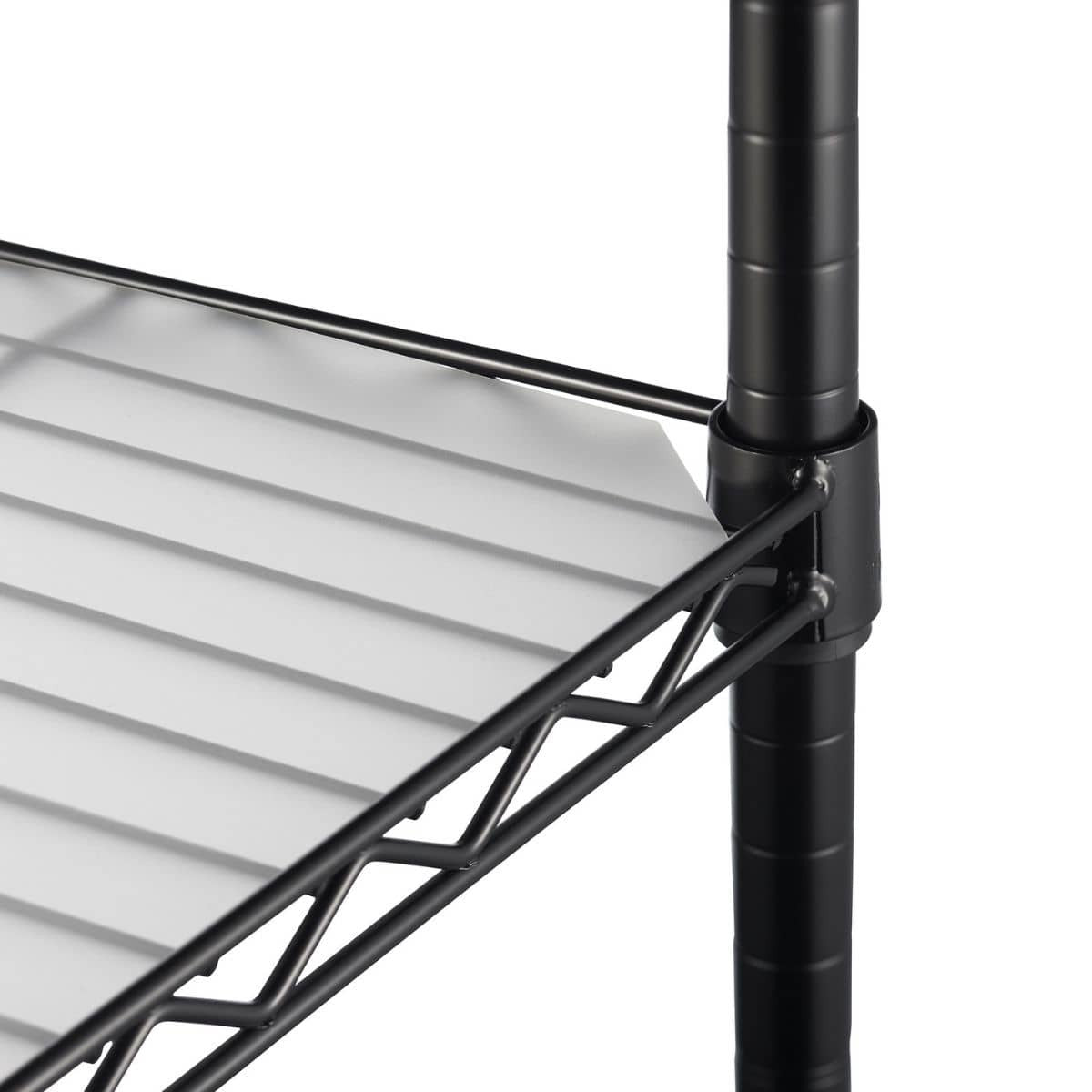 A close-up shows a section of a black wire shelving unit. A white shelf liner rests on the wire shelf, and a black pole and connecting hardware are visible on the right side.