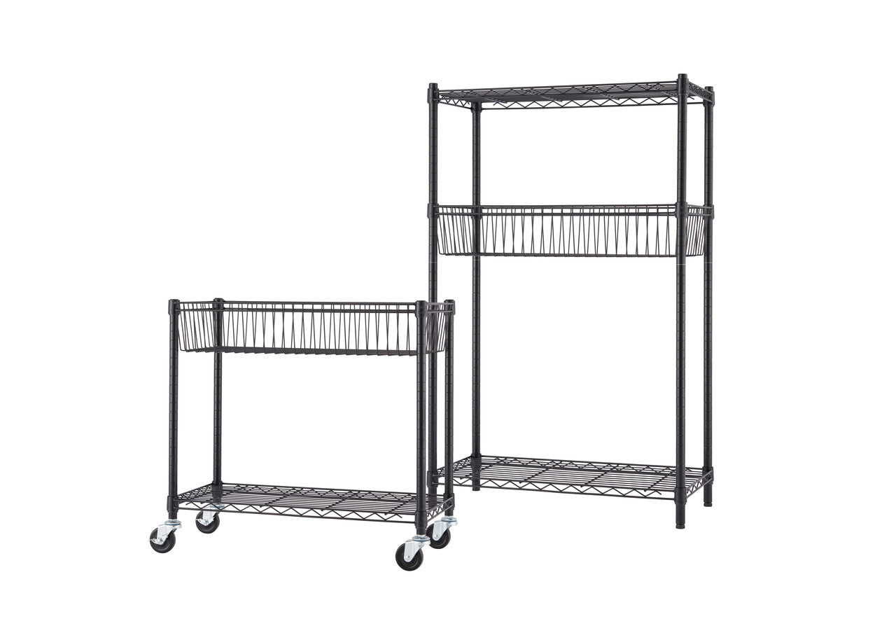 A product shot of two black wire shelving units on a white background. The unit on the left is shorter with two shelves and casters, while the unit on the right is taller with three shelves and stationary feet. Each unit has a wire basket on the middle shelf.