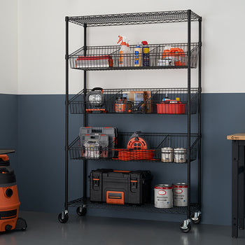 A black wire shelving unit with five tiers of baskets is filled with various tools and supplies in a garage setting. The unit is on wheels and stands against a two-toned wall, with a shop vac and a workbench visible in the background.