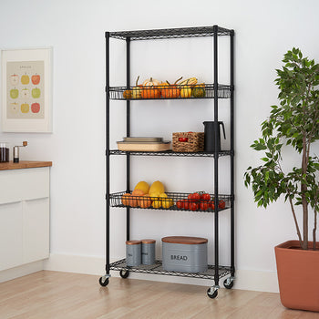 A black wire shelving unit with five tiers is shown against a white wall in a kitchen setting. The shelves hold various items including fruits, plates, and canisters, and the unit is on wheels.