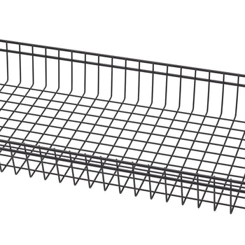 A close-up, angled shot of a black wire basket shelf, showing the grid pattern of the wires. The shelf is part of a larger shelving unit.