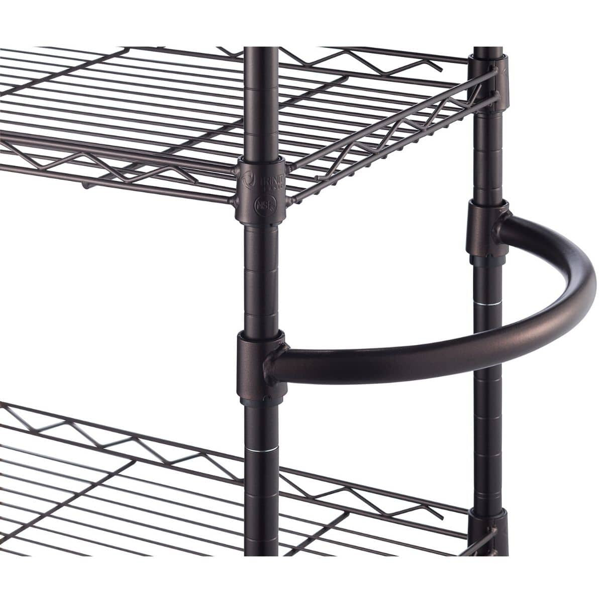 Close-up image of a metal wire shelving unit with a circular handle or guard rail attached to one of the middle shelves. The unit features adjustable shelves supported by vertical poles with grooved markings for positioning.