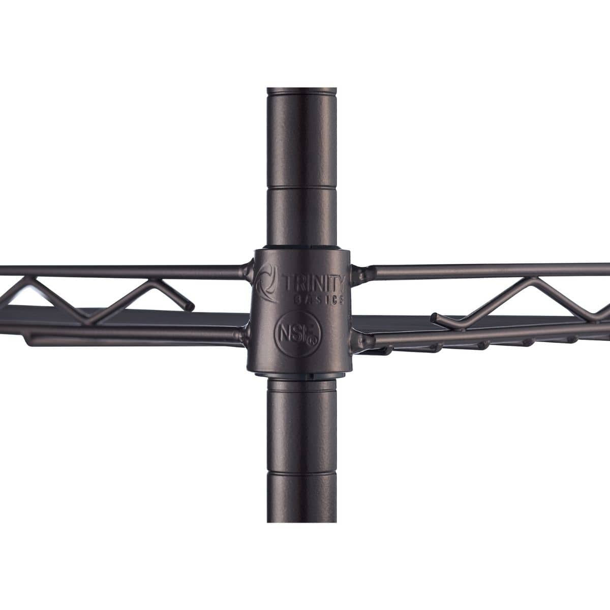 Close-up view of a dark brown metal pole with horizontal wire shelving extending to the left and right. The pole has visible grooves and a fitting connecting it to the shelf, with a "TRINITY BASICS" and "NSF" logo visible on the connector.