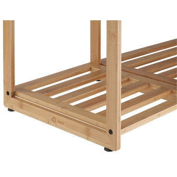 A close-up shot shows the base of a light brown bamboo shelf, likely part of a 