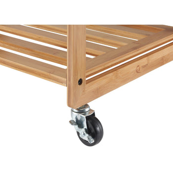 A close-up shot shows the bottom right corner of a Trinity 3-Bag Bamboo Laundry Cart, featuring a locking swivel caster wheel with a lock. The cart's natural bamboo shelves and frame are visible, highlighting the slatted design.