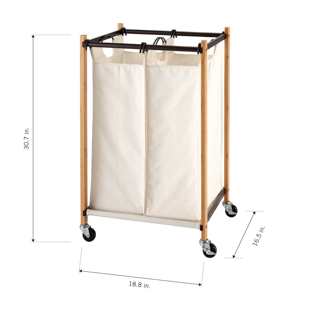 A beige, two-compartment laundry hamper with a light wooden frame and black metal accents is shown from an eye-level perspective. The hamper has black wheels and its dimensions are labeled as 30.7 inches in height, 18.8 inches in width, and 16.5 inches in depth.
