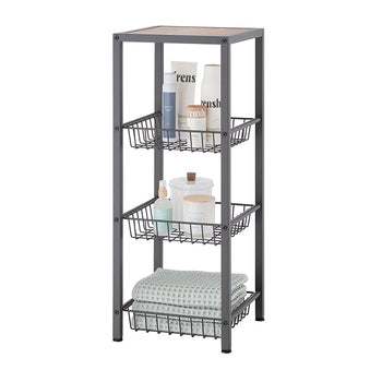 A dark gray metal shelving unit with three wire baskets and a wooden top shelf is displayed against a white background. The shelves hold various bathroom items including towels, lotions, sprays, and candles, suggesting its use for storage.