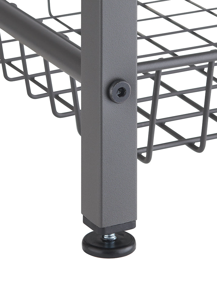 A close-up shot shows the bottom corner of a dark gray metal shelf unit. A black, circular leveling foot with a threaded bolt is visible at the base of the square leg, next to a wire shelf.