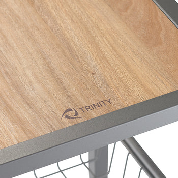A close-up shot shows a light brown wooden surface with the word 