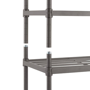 A close-up shows a section of a dark gray metal slat shoe rack during assembly. The image focuses on the interlocking poles and the slatted shelf, highlighting the construction and material of the Trinity 6-Tier Metal Slat Shoe Rack.