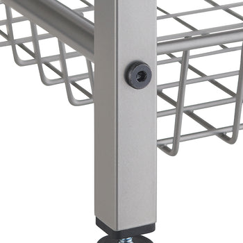 A close-up shot shows the bottom section of a metal shelving unit's leg. The leg is rectangular and silver-colored, with a black leveling foot screwed into its base.