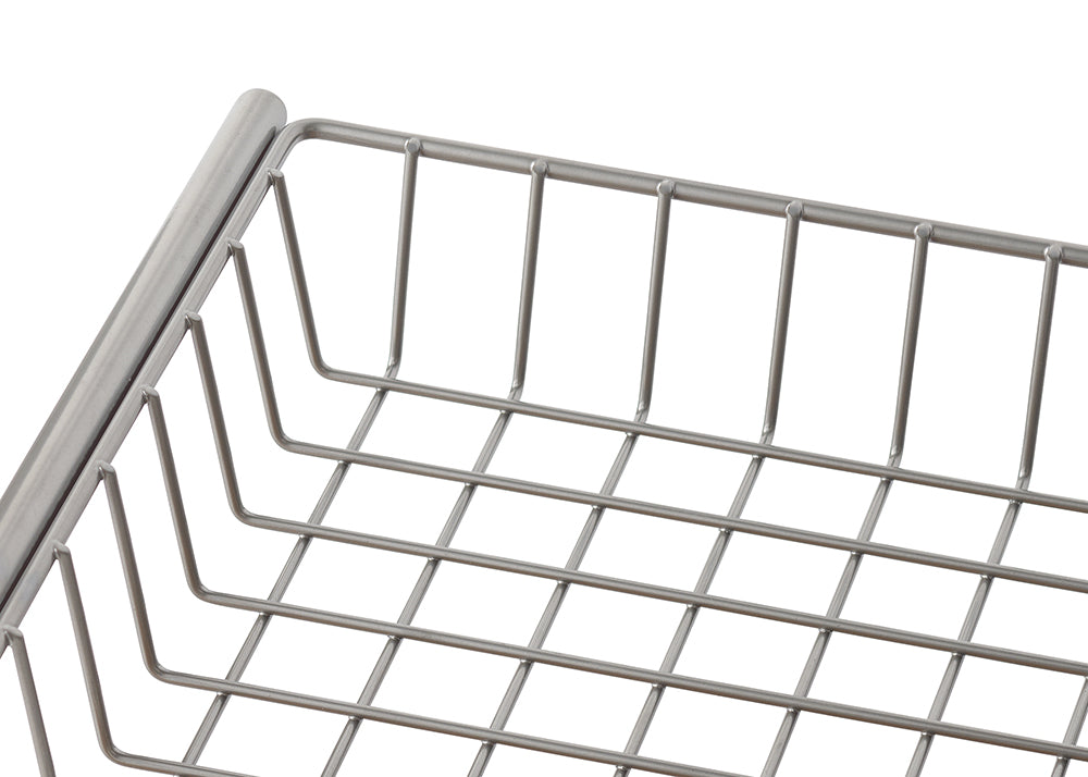A close-up shot shows a section of a silver-colored wire basket with a grid pattern. The basket appears to be made of metal, possibly stainless steel, and is seen from a slightly elevated angle against a white background.