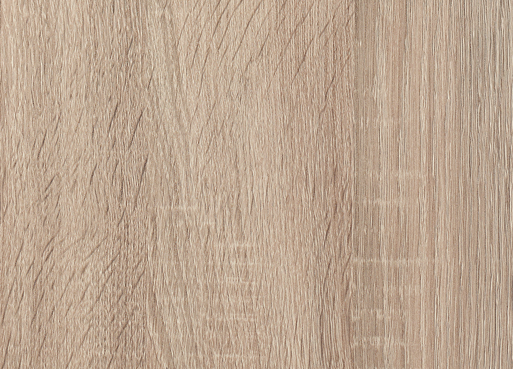 A close-up shot reveals the light brown, slightly textured surface of a wooden board. The wood grain runs vertically, displaying subtle variations in color and texture across its length.
