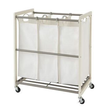 A white-colored Trinity 3-Bag Laundry Cart is shown with three removable white canvas laundry bags. The cart has a metal frame, a hanging bar for the bags, and wheels for portability.