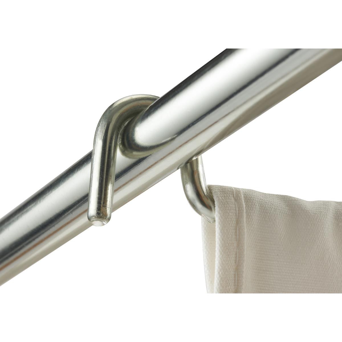 A close-up shot shows a white removable laundry bag hanging from a shiny, metallic shower rod. The curtain is attached to the rod by a metallic hook, which is looped around the rod and through a reinforced hole in the curtain.