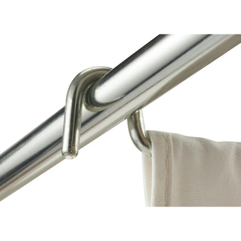 A close-up shot shows a white removable laundry bag hanging from a shiny, metallic shower rod. The curtain is attached to the rod by a metallic hook, which is looped around the rod and through a reinforced hole in the curtain.