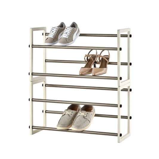 A white, four-tiered expandable shoe rack displays three pairs of shoes. The top shelf holds gray sneakers, the second shelf has beige heeled sandals, and the bottom shelf contains gray casual shoes.