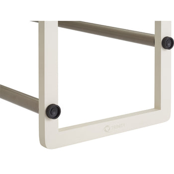 A close-up shows a portion of a Trinity Basics 2-Tier Expandable Shoe Rack. The image focuses on the white frame, adjustable brown metal bars, and black tightening knobs.