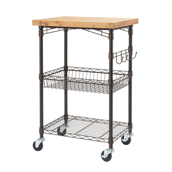 A three-tiered kitchen cart with a light-colored bamboo top, bronze metal frame, a wire basket on the second tier, and a wire shelf on the bottom tier is shown against a white background. The cart has four wheels and a set of three hooks hanging from one side.