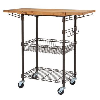 A bronze-colored metal kitchen cart with a light brown wooden butcher block with extended top is shown. The cart has two wire shelves below the top, four wheels for mobility, and three hooks hanging on one side.