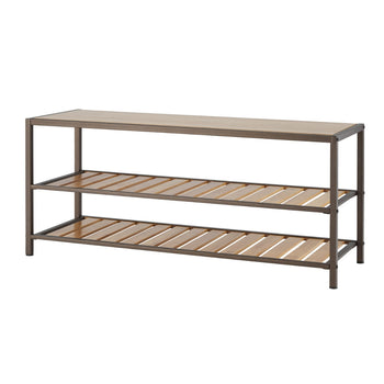 A three-tier shoe rack with a light brown wooden top and two lower shelves made of horizontal wooden slats within a bronze anthracite metal frame is shown against a white background. The furniture could also serve as a bench.