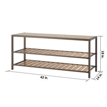 A three-tiered shoe rack with a bamboo top is shown at an angle. The rack has a bronze metal frame and two lower shelves made of horizontal bamboo slats, suitable for storing shoes. The top surface is a solid piece of bamboo, which can serve as a bench. The dimensions are labeled as 42 inches in length, 14 inches in depth, and 18 inches in height.