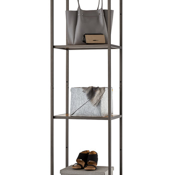 This tall, narrow four-tier shelving unit features a textured dark bronze metal frame with wood-grain accent panels on the top and bottom shelves. It is organized with everyday essentials, including a grey leather handbag and wallet on the second tier, a grey fabric storage bin on the third, and a pair of black sandals atop a woven storage box on the bottom shelf.