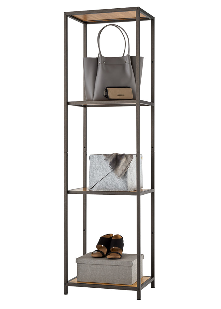 This tall, narrow four-tier shelving unit features a textured dark bronze metal frame with wood-grain accent panels on the top and bottom shelves. It is organized with everyday essentials, including a grey leather handbag and wallet on the second tier, a grey fabric storage bin on the third, and a pair of black sandals atop a woven storage box on the bottom shelf.