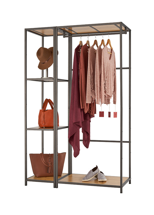 A bronze anthracite closet organizer with bamboo shelves displays various fashion items. These include hanging sweaters and a scarf, a hat on a stand, handbags on shelves, and a pair of shoes on the bottom.