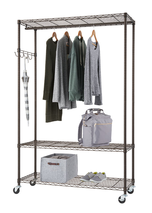 A bronze anthracite metal rolling closet organizer with 3 shelves and 1 hanging rod filled with clothes, a bag, and shoe.