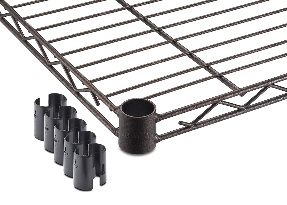 A close-up view highlights the corner collar and wire grid design of a bronze wire shelf alongside four pairs of black plastic slip sleeves. The textured metal shelf features a circular corner sleeve stamped with the TRINITY logo for secure assembly on pole systems.