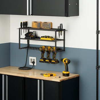 A metal-framed storage rack is mounted on a two-toned wall above a black cabinet with a wooden countertop. The rack holds several items, including a row of three DeWalt power drills, charging batteries, screwdriver bits, and various hand tools.