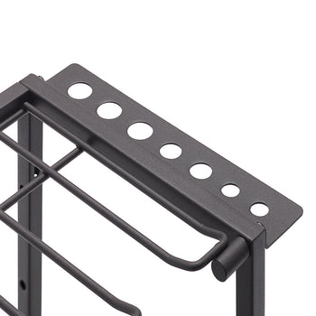 A close-up, high-angle shot of the top corner of a black metal wire storage rack. The rack has a gridded wire bottom and a perforated top shelf with different-sized holes, designed to hold various tools or utensils.