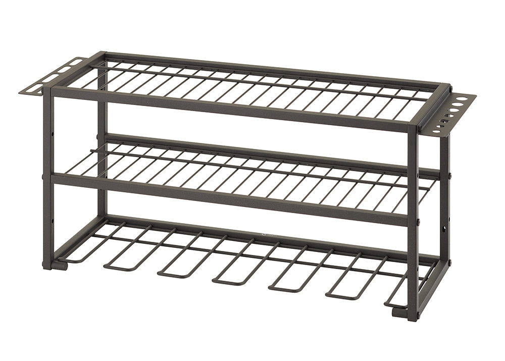
A two-tier, dark metal tool organizer. It has two flat wire shelves for storage, hooks underneath for hanging power drills, and perforated side panels with slots to hold various hand tools.