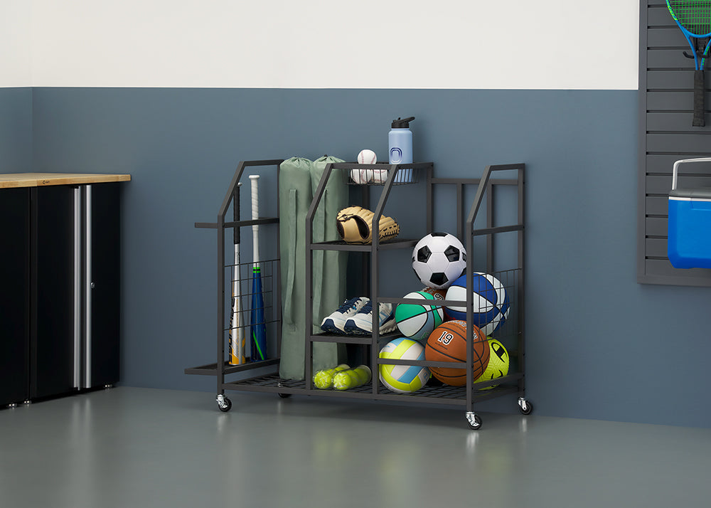A black rolling sports equipment rack is shown fully organized with various balls, bats, gloves, and sneakers against a garage wall. All items are neatly categorized and stored within the multi-level sections of the cart, showcasing its storage capabilities.
