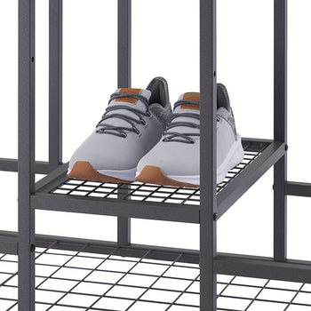 A pair of grey sneakers with brown soles and leather tongue accents sits on a small wire mesh shelf of a black metal organizer. The close-up view highlights the storage capacity of the industrial-style rack, shown against a plain white background.