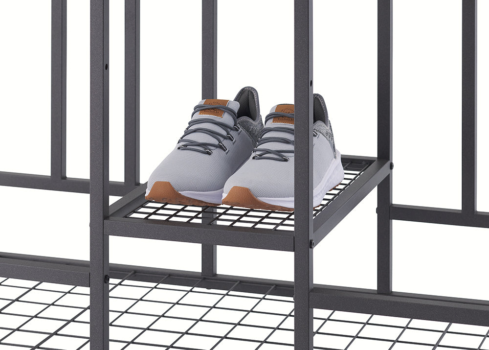 A pair of grey sneakers with brown soles and leather tongue accents sits on a small wire mesh shelf of a black metal organizer. The close-up view highlights the storage capacity of the industrial-style rack, shown against a plain white background.