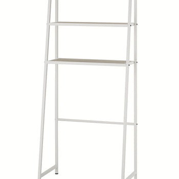A simple, free-standing white metal A-frame over-the-toilet étagère is depicted against a white background. It features a white metal frame with two light wood-toned shelves and is shown without any decorative items.