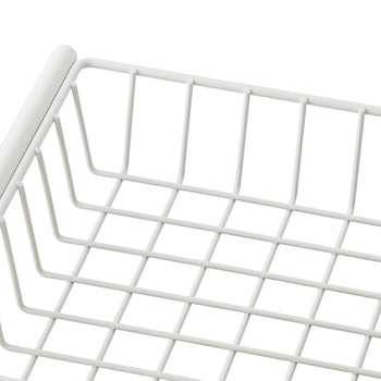 A close-up shot of a white wire basket shows its grid pattern and the smooth, rounded edges of the top frame. The basket appears to be made of metal with a clean, light-colored finish.