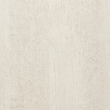 A full-frame, overhead shot shows a light beige, off-white wood surface with a distressed finish. 