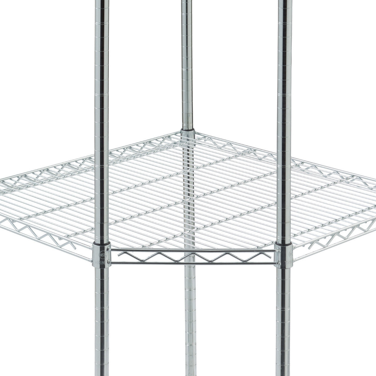 A close-up shot shows the corner shelf of a Trinity EcoStorage 4-Tier Corner Wire Shelving Unit with Wheels. The chrome-plated wire shelf has a triangular shape, designed to fit into a corner, with its support poles visible at the edges.