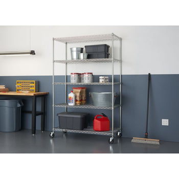 A tall, five-tier wire shelving rack on wheels stands against a two-toned wall in a garage or storage space. The shelves hold various storage containers, buckets, bags, and a red gas can.