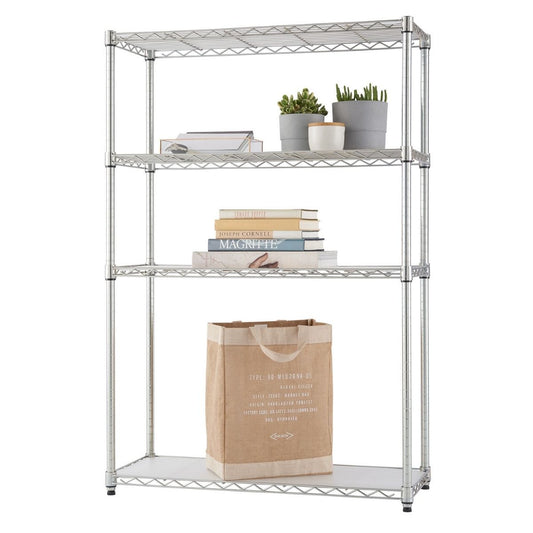 A four-tier wire shelving unit stands against a white background, holding various items. On the shelves are books, including one titled "MAGRITTE," potted plants, a white mug, and a large tan tote bag.