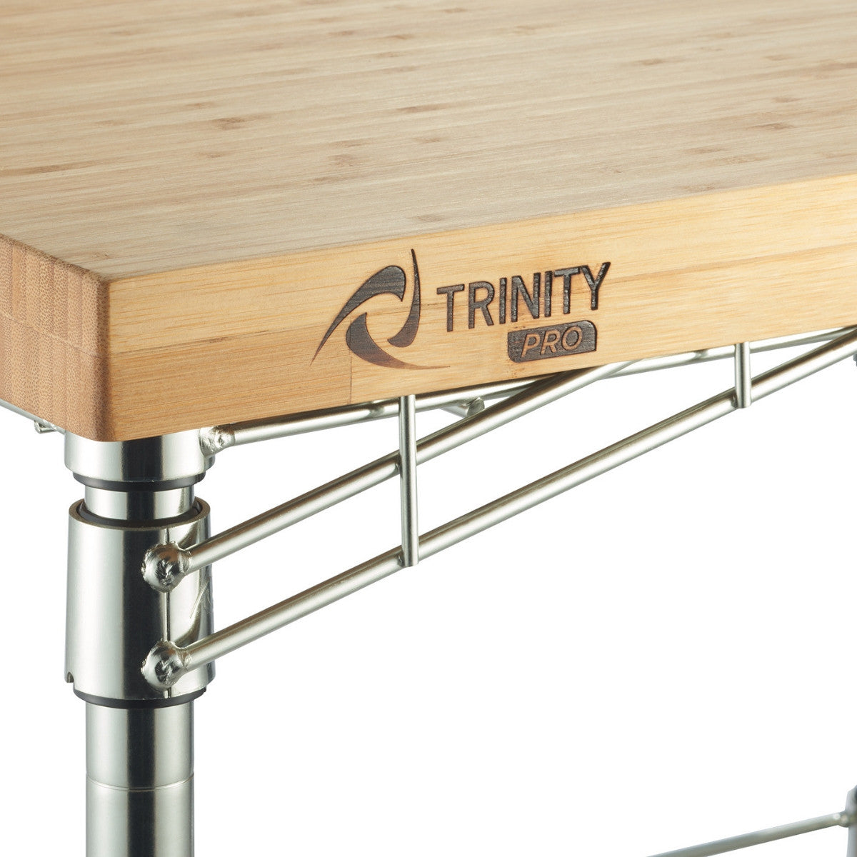 A close-up shows a corner of a Trinity Pro expandable bamboo kitchen cart. The light-colored bamboo countertop features the "TRINITY PRO" logo branded into the wood.