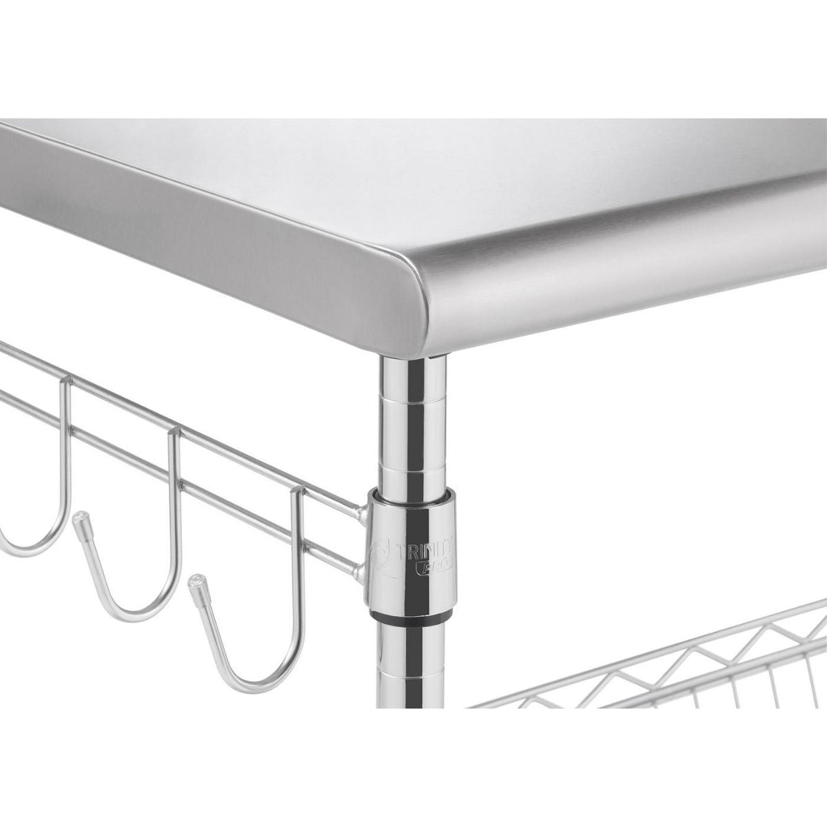  A close-up shot shows the 1.5 inch thick top portion of a stainless steel kitchen cart. Visible details include a smooth stainless steel top, a chrome support pole with a black collar, and a wire rack with hanging hooks attached to the side.