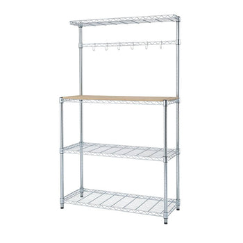 A chrome bakers rack with three wire shelves, a light brown wooden countertop, and an upper section with a wire shelf and hanging hooks is shown against a white background. The rack appears to be the Trinity Traditional Ecostorage Chrome Steel Bamboo Bakers Rack.